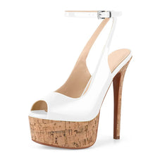 Load image into Gallery viewer, White high-heeled shoe with cork platform on a white background