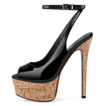 Load image into Gallery viewer, Black high-heeled shoe with cork platform on a white background