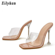 Load image into Gallery viewer, Beige high-heeled sandals with clear transparent straps on a white background, branded 'Eilyken'.