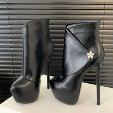 Load image into Gallery viewer, Black high-heeled platform boots with a decorative flower on a neutral background