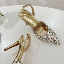Load image into Gallery viewer, Gold high-heeled shoes with crystal embellishments on a white surface.