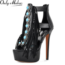 Load image into Gallery viewer, Black high-heeled shoe with turquoise embellishments and fringes on a white background