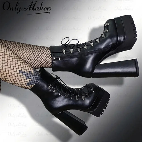 Black platform boots with high heels worn by a person on a light gray background, featuring the brand 'Only Maker'.