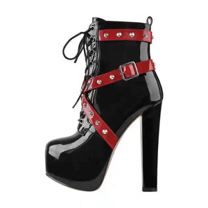 Black high-heeled boot with red straps and buckles on a white background