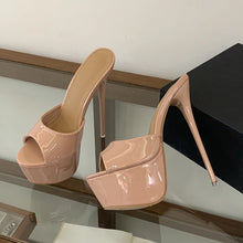 Load image into Gallery viewer, Pair of pink high-heeled shoes on a glass surface with a neutral background