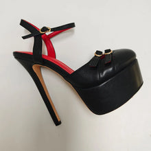Load image into Gallery viewer, Black high-heeled shoe with red interior on a white background
