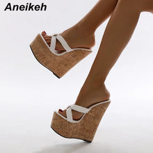 Load image into Gallery viewer, Wicker wedge sandals with white straps worn by a person on a light gray background, featuring the brand &#39;Aneikeh&#39;.