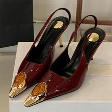 Load image into Gallery viewer, Red high-heeled shoes with gold accents on a white surface