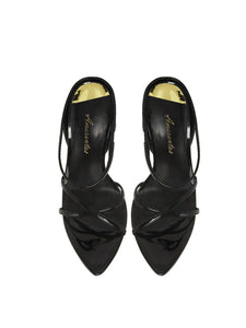Black high-heeled shoes with criss-cross straps on a white background