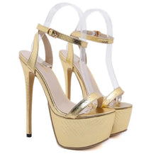 Load image into Gallery viewer, Gold high-heeled platform sandals on a white background