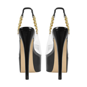 Black high-heeled shoes with gold chain straps on a white background