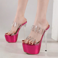 Load image into Gallery viewer, Pink high-heeled shoes with clear platforms and embellishments on a neutral background
