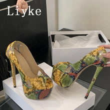 Load image into Gallery viewer, A pair of high-heeled platform pumps with a multicolor snakeskin pattern in yellow, green, and red, shown with a shoebox and a hand holding one shoe. The brand name 'Liyke' is visible as an overlay.