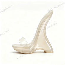 Load image into Gallery viewer, A single transparent jelly high-heeled sandal with a curved sculptural heel and a clear toe strap, shown in profile against a plain white background.