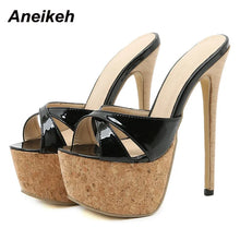 Load image into Gallery viewer, Black patent high-heeled sandals with cork platforms on a white background, branded &#39;Aneikeh&#39;.