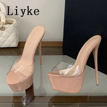 Load image into Gallery viewer, A pair of high-heeled platform sandals in a nude pink patent finish with clear plastic toe covers, displayed on a glass table. A white quilted handbag is partially visible on the left, and the brand name 'Liyke' is printed in black text in the upper left corner.
