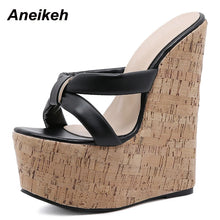 Load image into Gallery viewer, Wedge sandal with cork texture sole and black strap on a white background, brand &#39;Aneikeh&#39; visible.
