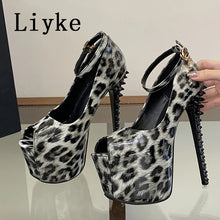 Load image into Gallery viewer, A pair of high-heeled platform sandals with a black and white leopard print pattern, featuring spiked stiletto heels and ankle straps. A hand is holding one of the shoes, and the brand name 'Liyke' is visible in the top left corner.