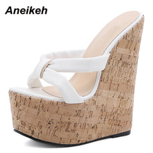 Load image into Gallery viewer, White wedge sandal with cork wedge on a white background, brand &#39;Aneikeh&#39; visible.