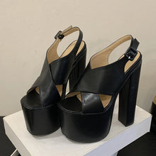 Load image into Gallery viewer, Black platform sandals on a white surface with a neutral background
