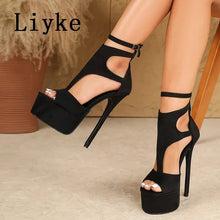 Load image into Gallery viewer, Black high-heeled sandals with cut-out design worn by a person, brand 'Liyke' visible.