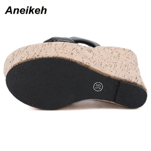 Cork sandal sole with black insole on a white background, featuring the brand 'Aneikeh'.