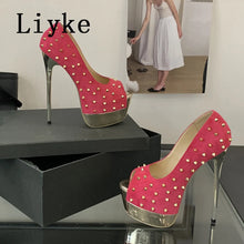 Load image into Gallery viewer, Pink high-heeled shoes with gold studs on a black surface, branded &#39;Livke&#39;.