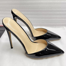 Load image into Gallery viewer, A pair of black patent leather slingback pointed-toe high heels with beige insoles, displayed on a white surface against a textured gray background.