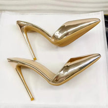 Load image into Gallery viewer, A pair of metallic gold pointed-toe stiletto pumps with a glossy finish, displayed on a white background.