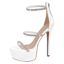 Load image into Gallery viewer, White high-heeled shoe with silver straps on a white background