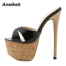 Load image into Gallery viewer, High-heeled shoe with cork platform and black patent leather straps on a white background