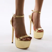 Load image into Gallery viewer, Gold high-heeled platform shoes on a white background