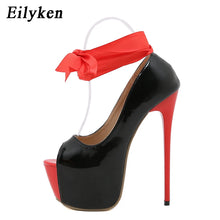 Load image into Gallery viewer, Black and red high heels side view.