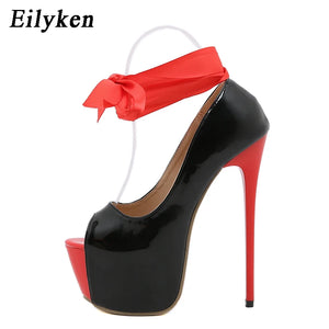 Black and red high heels side view.