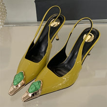 Load image into Gallery viewer, Yellow high-heeled shoes with green embellishments on a reflective surface