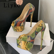 Load image into Gallery viewer, A pair of women's high-heeled platform pumps with a multicolor snakeskin pattern, displayed on white shoe boxes. The shoes feature a glossy finish and cutout toes.