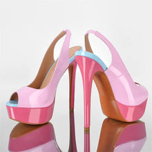 Load image into Gallery viewer, Pink high-heeled shoes with a blue accent on a reflective surface.