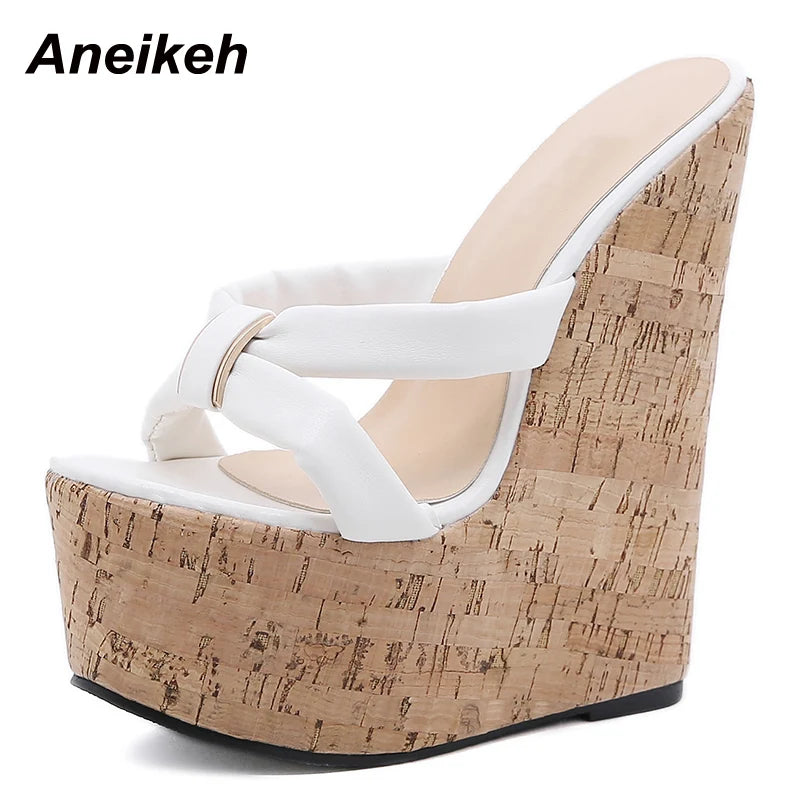 White wedge sandal with cork wedge on a white background, brand 'Aneikeh' visible.