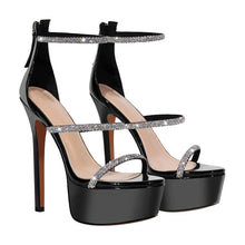 Load image into Gallery viewer, Black high-heeled platform sandals with rhinestone straps on a white background