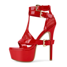 Load image into Gallery viewer, A single red high-heeled platform sandal with ankle straps, cutout details, and gold-tone buckles, shown on a plain white background.