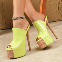 Load image into Gallery viewer, Yellow high-heeled shoes with cork platforms on a neutral background