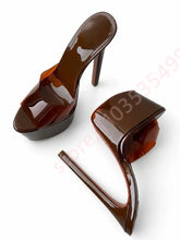 Load image into Gallery viewer, A pair of glossy dark brown patent leather high-heeled mule sandals with platform soles, shown on a white background.