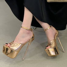 Load image into Gallery viewer, Gold high-heeled platform shoes worn with a black skirt on a neutral background