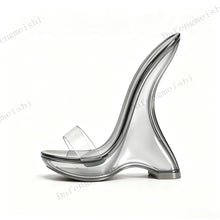 Load image into Gallery viewer, A single transparent clear high-heeled shoe with a sculptural curved heel and a wide clear strap, shown in side profile on a white studio background with faint repeated watermark text.