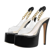 Load image into Gallery viewer, Black high-heeled shoes with clear platforms and gold chain straps on a white background