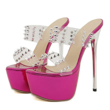 Load image into Gallery viewer, Pink high-heeled shoes with clear platform and silver stud details on a white background