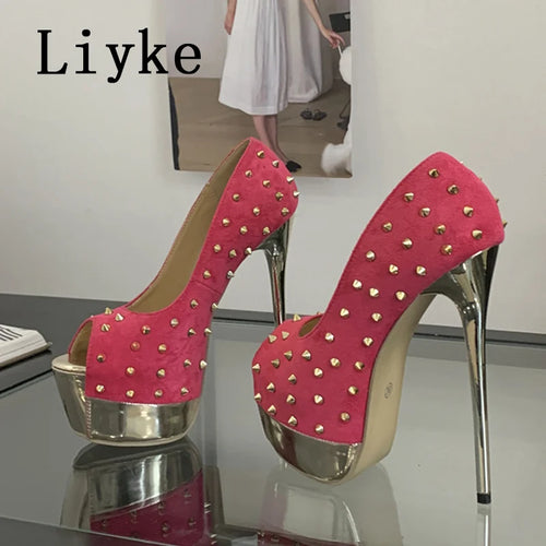 Pink high-heeled shoes with gold studs on a reflective surface, branded 'Liyke'.