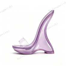 Load image into Gallery viewer, A single translucent purple high-heeled shoe with a wide clear strap, shown in profile on a white background with faint repeating watermark text.