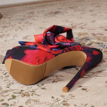 Load image into Gallery viewer, High-heeled shoe with a colorful ribbon on a patterned carpet