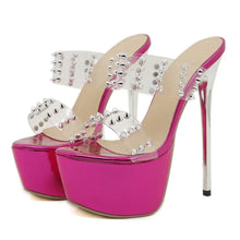 Load image into Gallery viewer, Pink high-heeled shoes with studded details on a white background